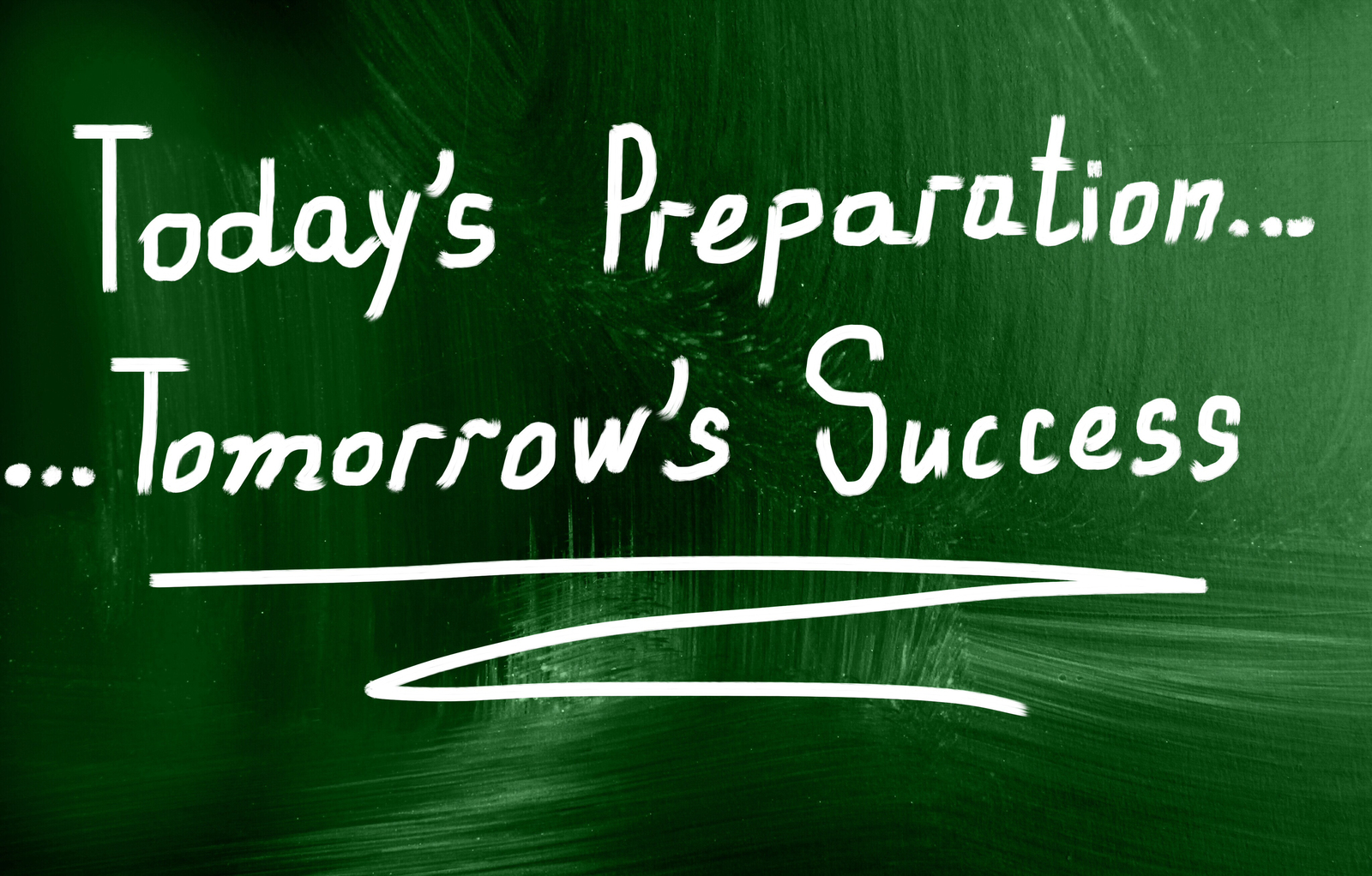 A green chalkboard with the text: "Today's Preparation...Tomorrow's Success" written in white.